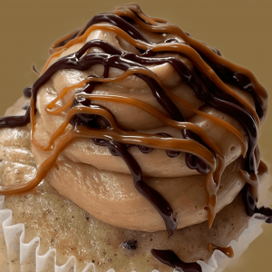 Cupcake dripping with caramel and chocolate by the makery cake co in denver