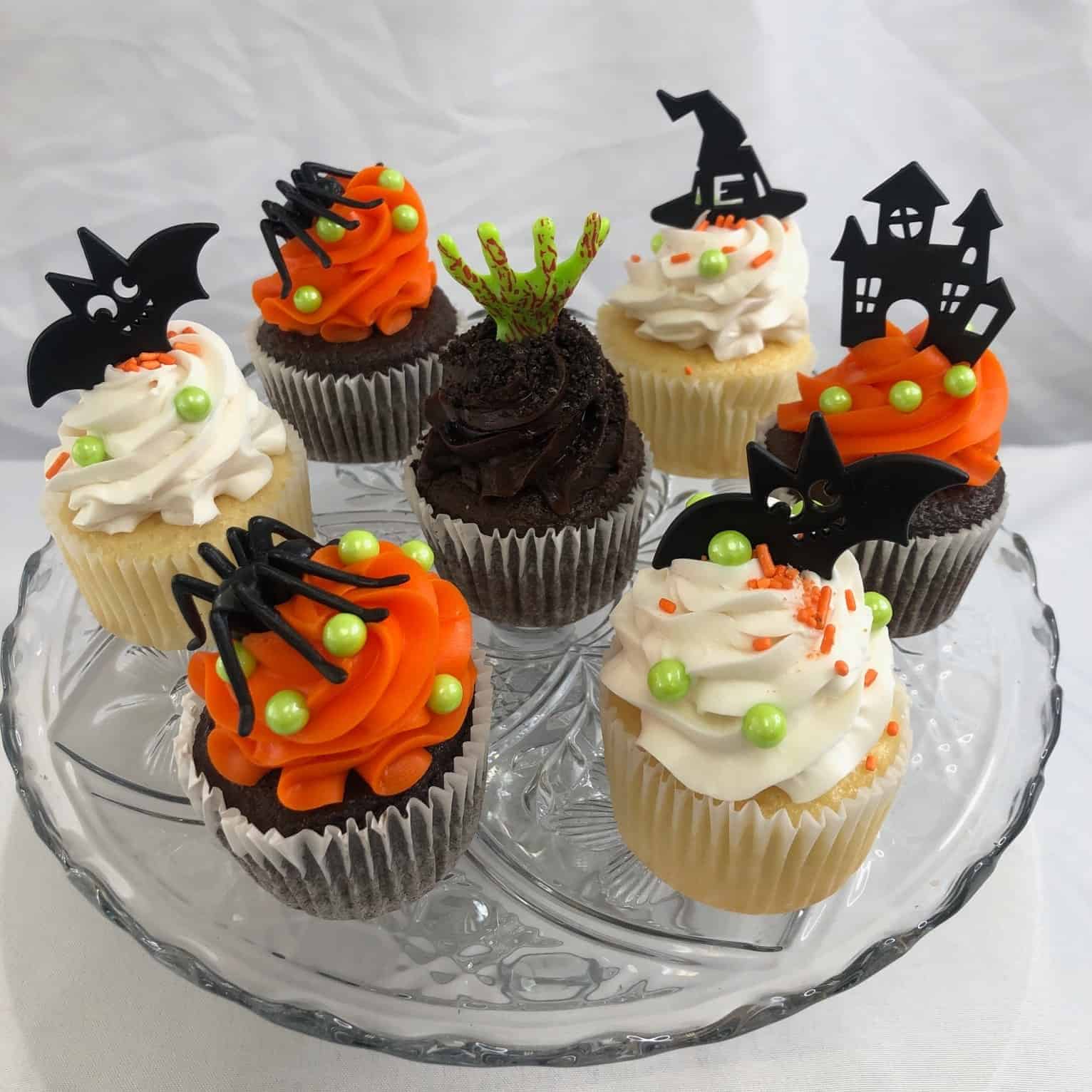 Halloween cupcakes with plastic Spider, Bay, Ghost, Witch hat, and Zombie Hands picks